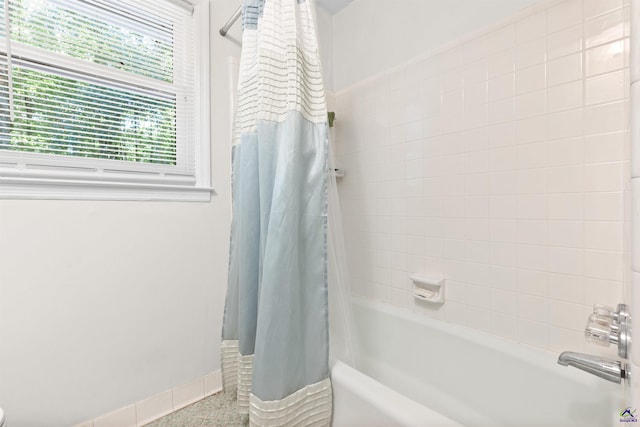 bathroom with shower / tub combo