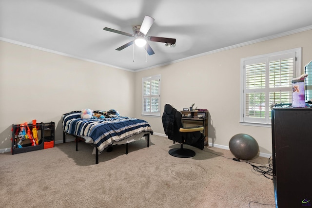 carpeted bedroom featuring ceiling fan and ornamental molding