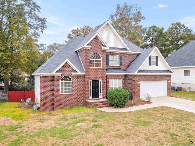 view of front of home featuring a front yard and a garage