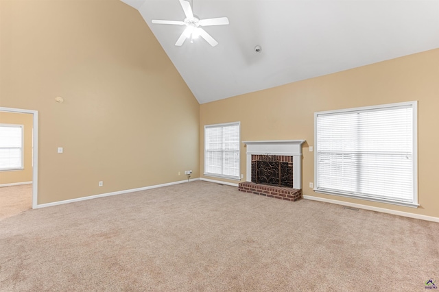 unfurnished living room with ceiling fan, high vaulted ceiling, light carpet, and a brick fireplace