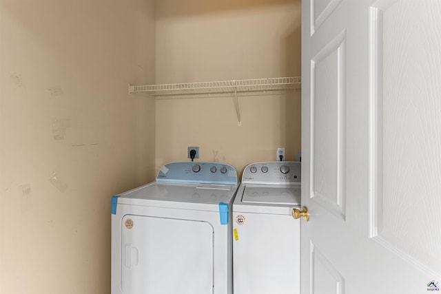 clothes washing area with independent washer and dryer