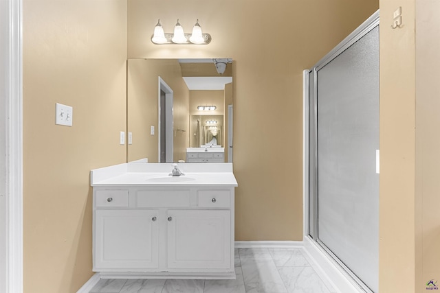 bathroom with vanity and an enclosed shower