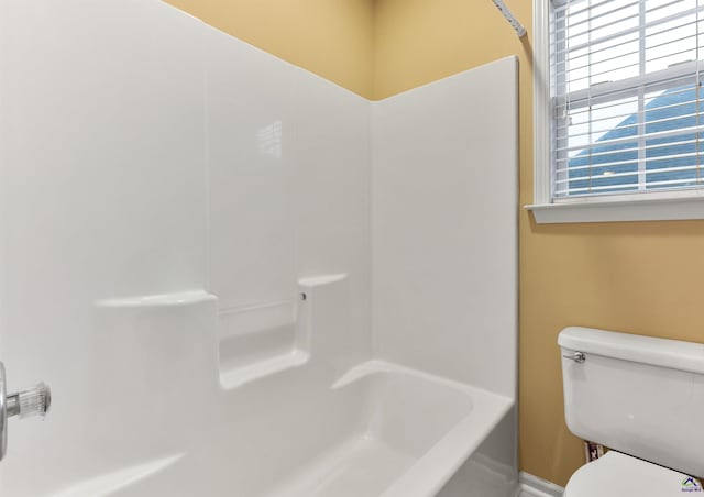 bathroom with toilet and shower / washtub combination