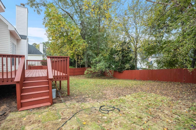 view of yard with a wooden deck