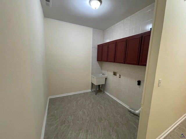 laundry room with sink, cabinets, tile walls, and hookup for a washing machine