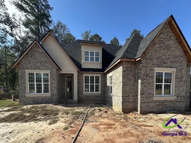 view of front of home with brick siding