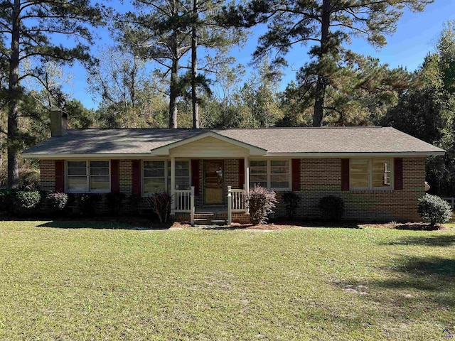 139AND137 Ga Highway 257, Cochran, GA 31014 - ranch-style house with covered porch, a front lawn, brick siding, and a chimney