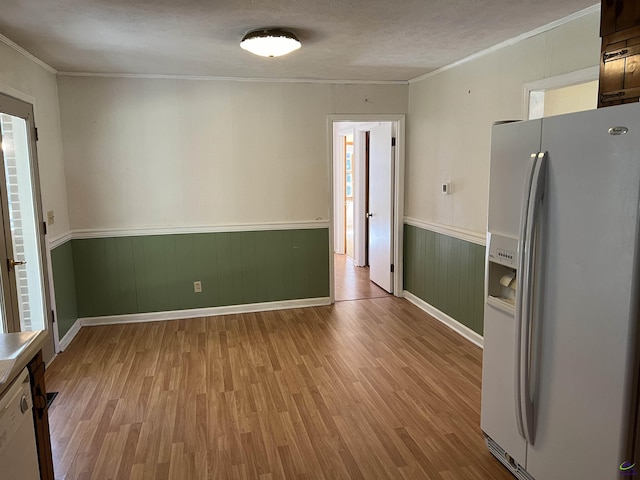139AND137 Ga Highway 257, Cochran, GA 31014 - unfurnished dining area featuring light wood finished floors, crown molding, wainscoting, and baseboards
