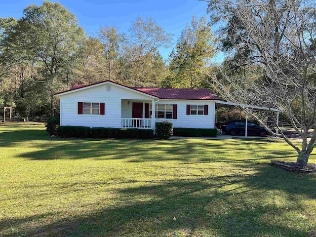 view of front facade featuring a front yard, a carport, and covered porch