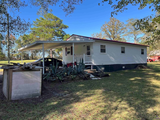 rear view of property featuring a yard