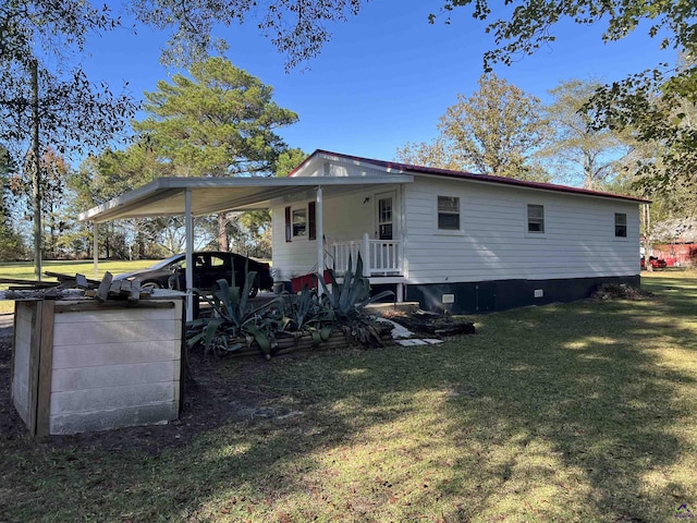 139AND137 Ga Highway 257, Cochran, GA 31014 - back of house with a lawn and a carport