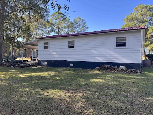 139AND137 Ga Highway 257, Cochran, GA 31014 - rear view of house featuring a lawn, crawl space, metal roof, and central air condition unit