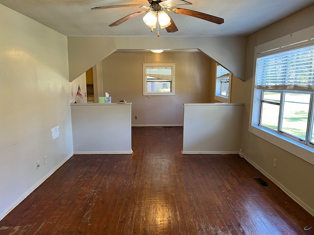 bonus room with dark hardwood / wood-style floors and ceiling fan