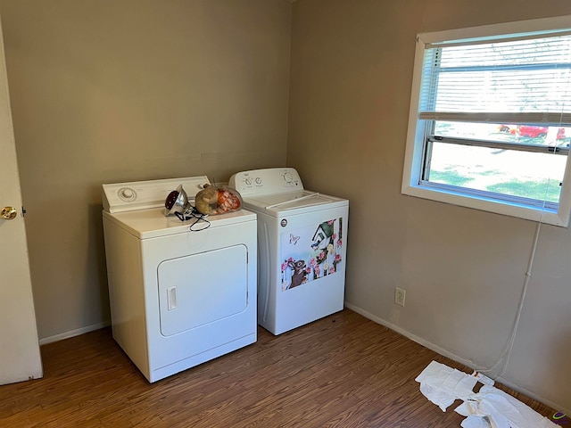 washroom featuring hardwood / wood-style floors and washer and dryer