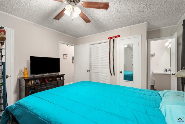 bedroom with ceiling fan, a closet, a textured ceiling, and ornamental molding