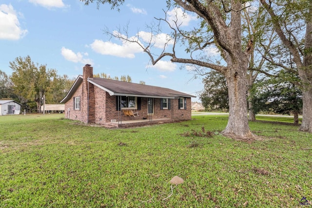 ranch-style home featuring a patio area and a front yard