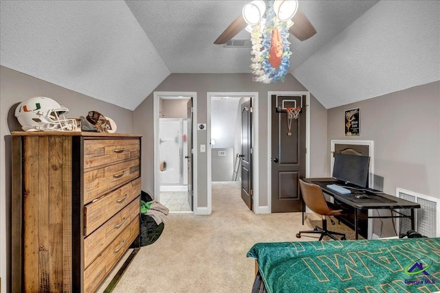 carpeted bedroom with a textured ceiling, ensuite bathroom, ceiling fan, and vaulted ceiling