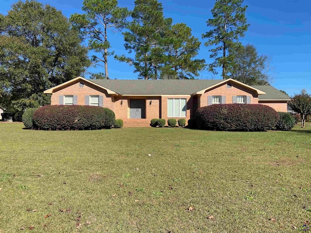 ranch-style house with a front yard