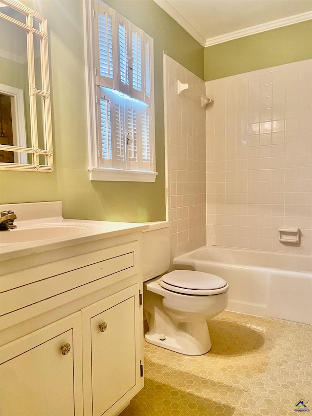 full bathroom with vanity, tile patterned floors, crown molding, tiled shower / bath, and toilet