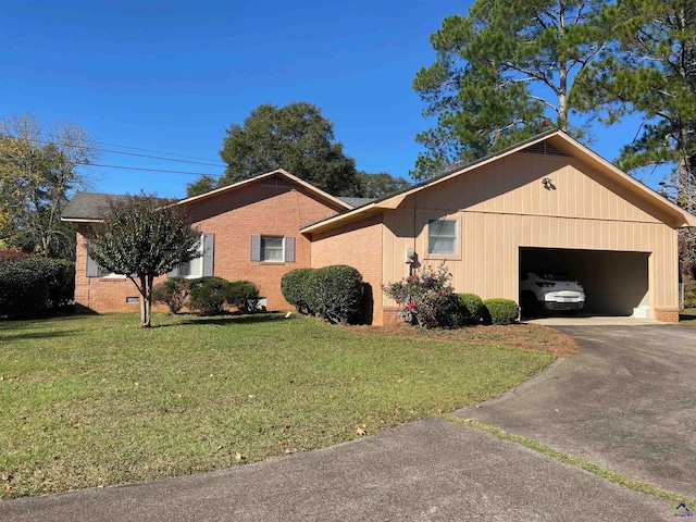 single story home with a front yard and a garage