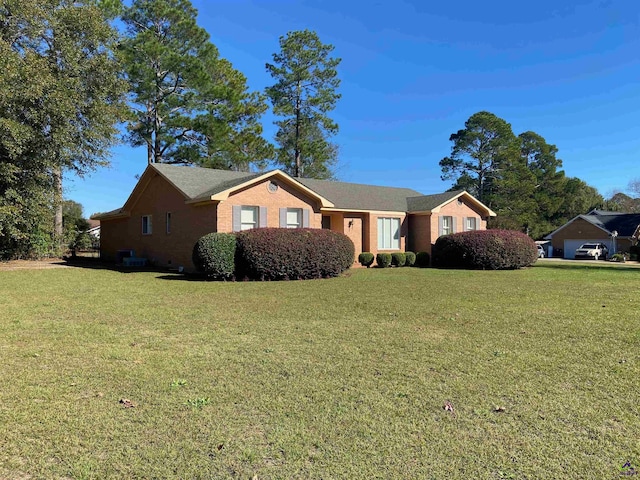 ranch-style home with a front yard