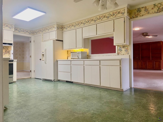 kitchen featuring white cabinets, ventilation hood, white appliances, and ornamental molding