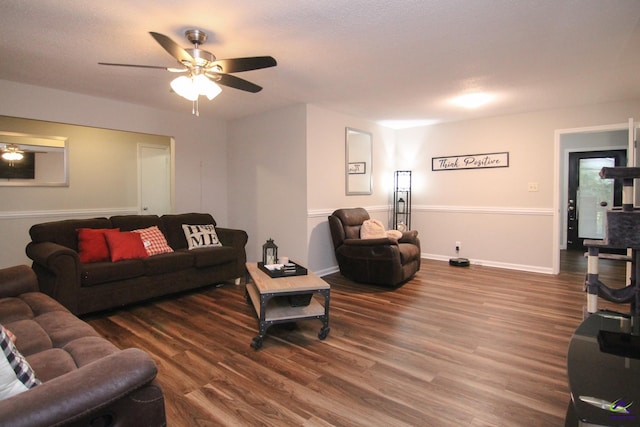 living room with hardwood / wood-style floors, ceiling fan, and a textured ceiling