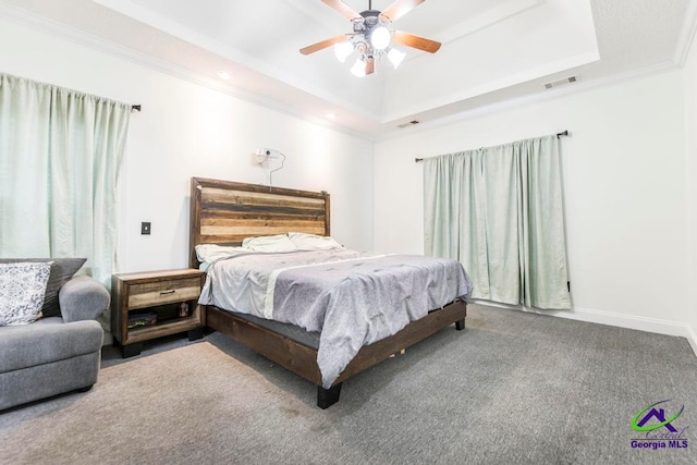 bedroom featuring carpet, a raised ceiling, ceiling fan, and ornamental molding