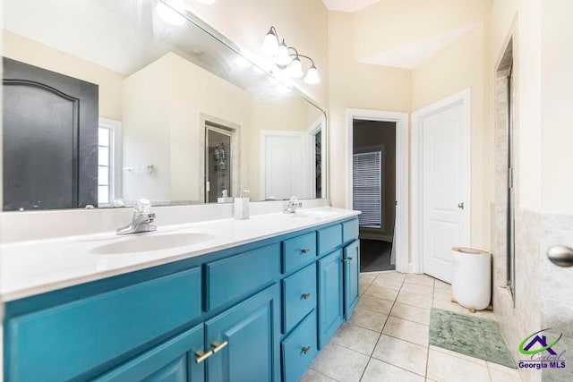 bathroom with tile patterned floors and vanity