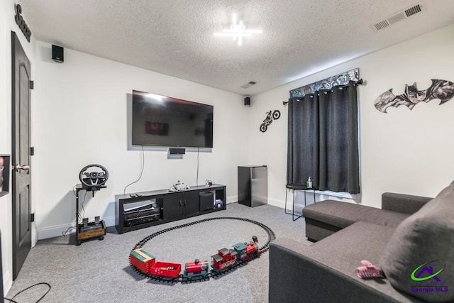 living room featuring carpet and a textured ceiling