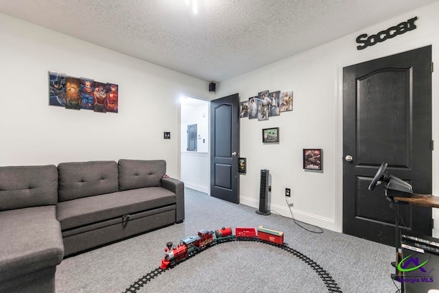 living room featuring carpet and a textured ceiling