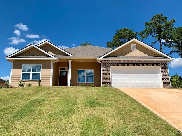 view of front facade with a front lawn and a garage