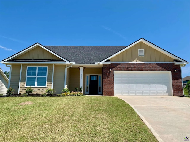 view of front facade featuring a front yard and a garage