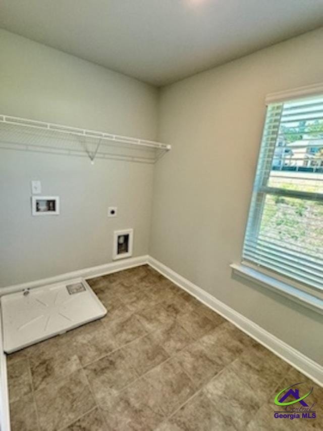 laundry room featuring hookup for an electric dryer and hookup for a washing machine