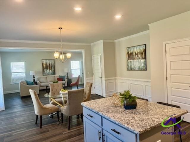 dining room with a chandelier, crown molding, plenty of natural light, and dark wood-type flooring