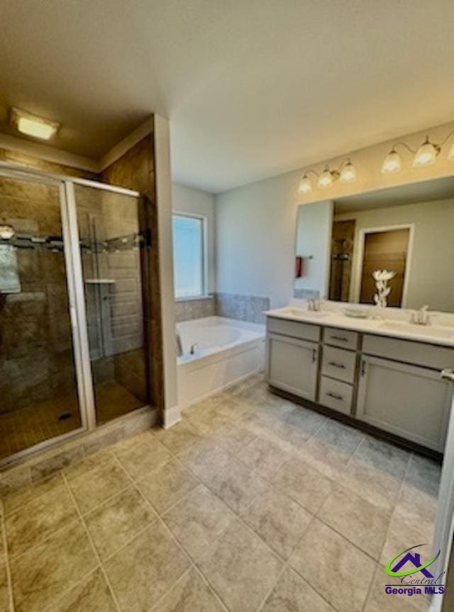 bathroom featuring tile patterned floors, vanity, and independent shower and bath