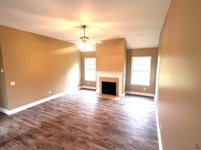 unfurnished living room with dark hardwood / wood-style floors, ceiling fan, and lofted ceiling