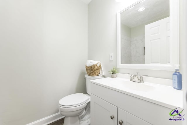 105 Westcliff Cir, Warner Robins, GA 31093 - bathroom with vanity, toilet, and baseboards