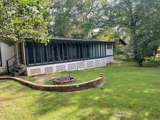 view of yard with a sunroom