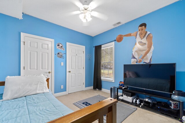 carpeted bedroom with ceiling fan