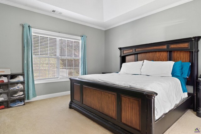 carpeted bedroom with ornamental molding