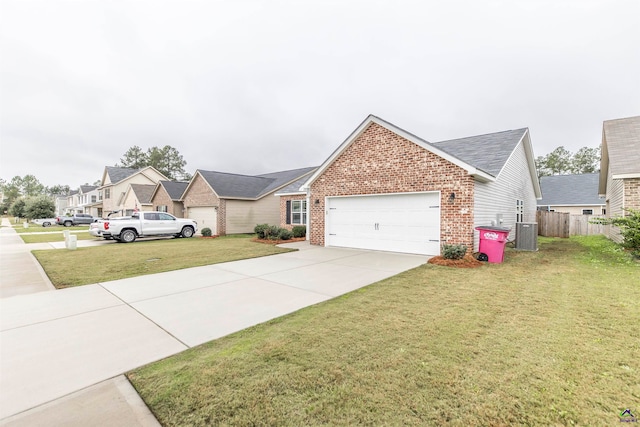 single story home with central AC, a front yard, and a garage