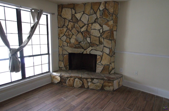 details with a fireplace and hardwood / wood-style flooring