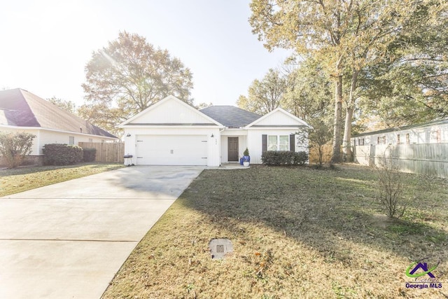 view of front facade featuring a front lawn and a garage