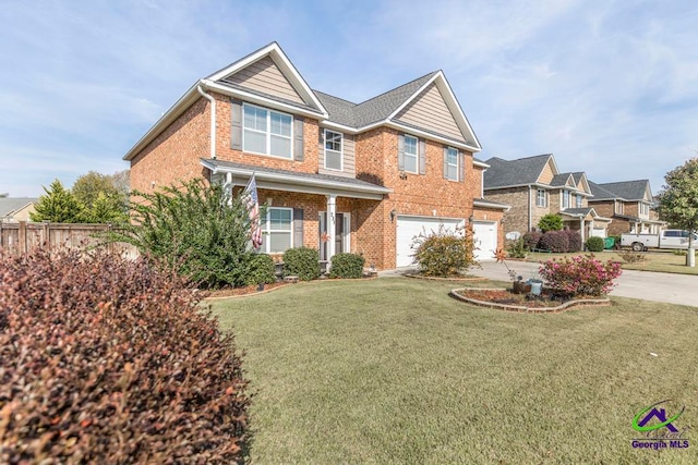 view of front of property featuring a garage and a front lawn