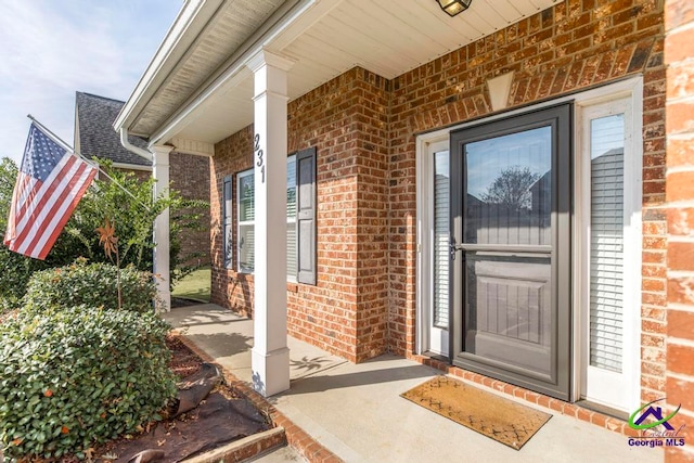 property entrance with covered porch