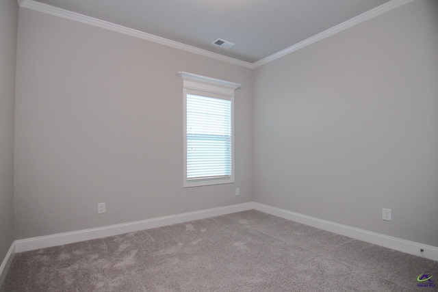 carpeted spare room featuring ornamental molding