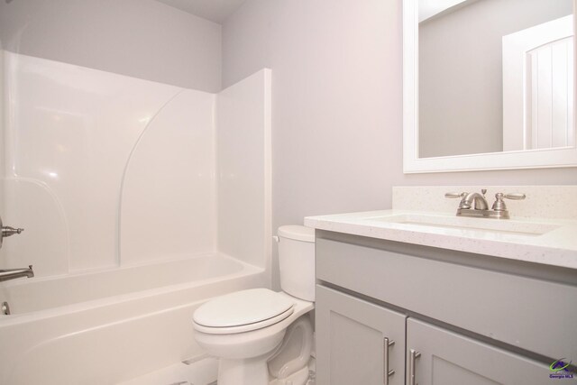 full bathroom featuring vanity, toilet, and bathing tub / shower combination