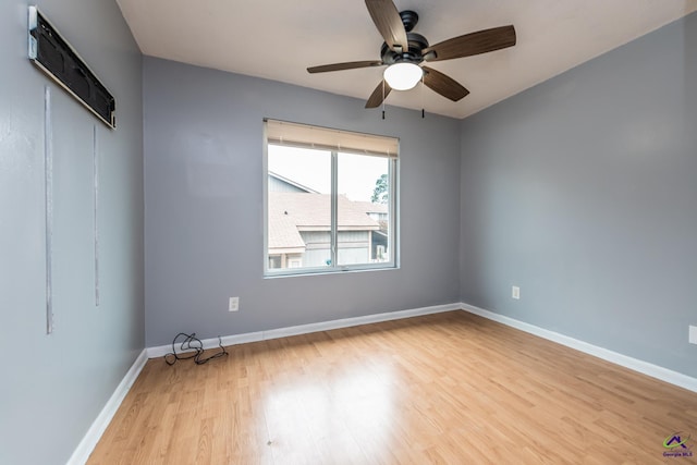 spare room featuring ceiling fan and light hardwood / wood-style flooring