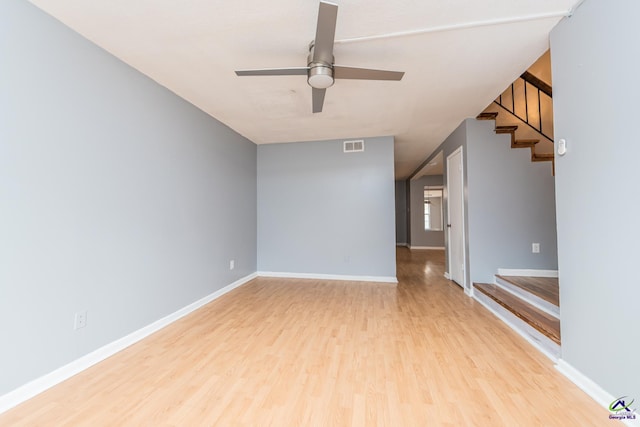 spare room with ceiling fan and light hardwood / wood-style floors